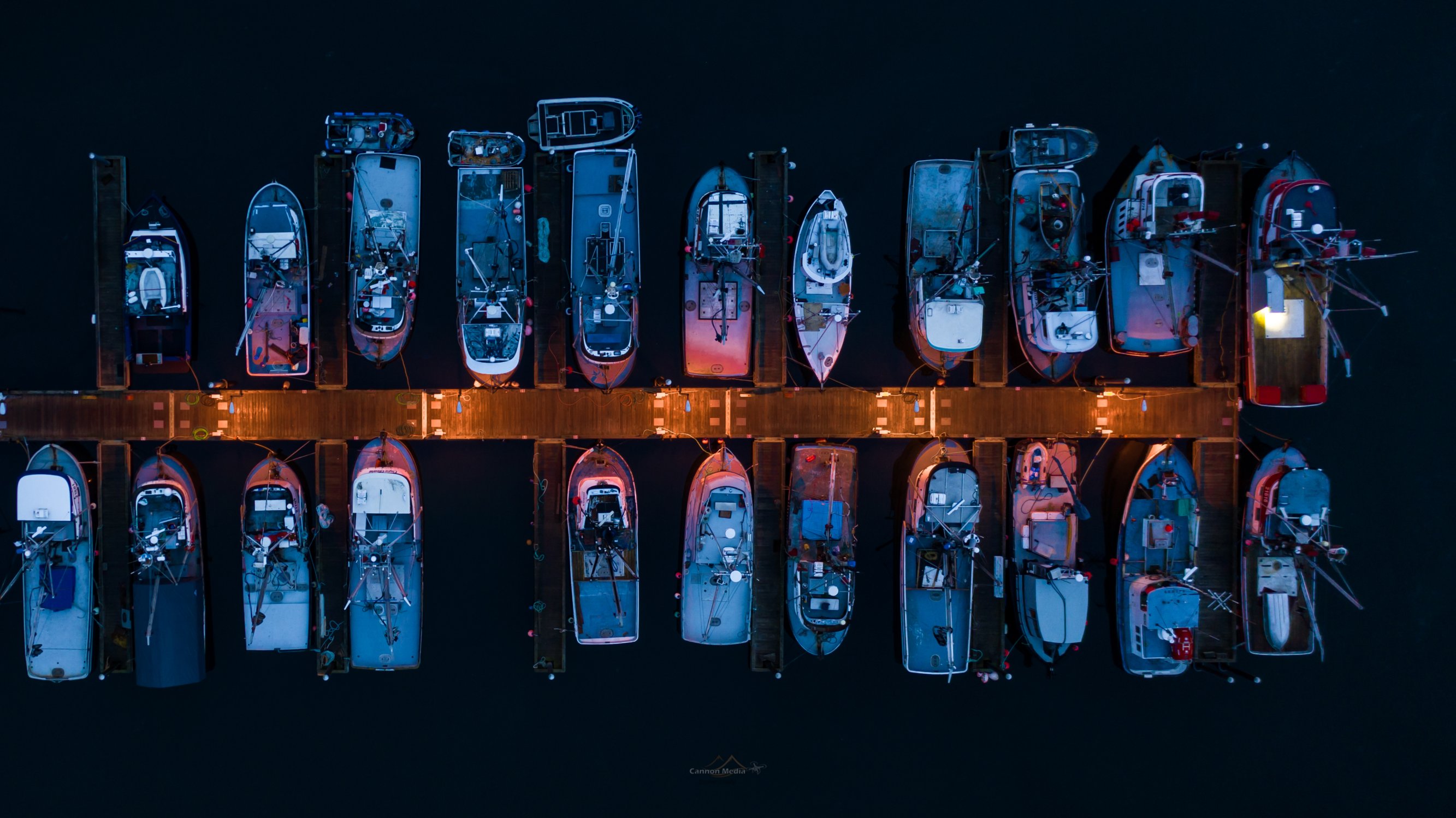 John Cannon aerial photograph of fishing boats tied up in Kodiak harbor