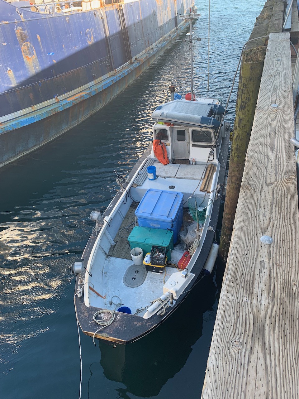 Small boat moored alongside a Kodiak dock